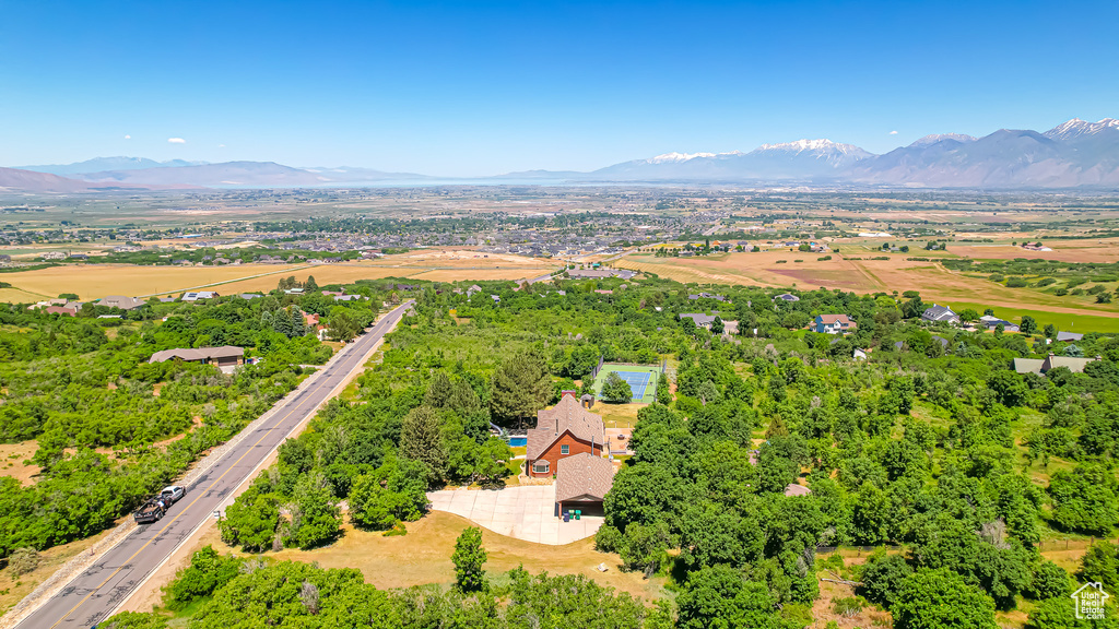 Birds eye view of property with a mountain view