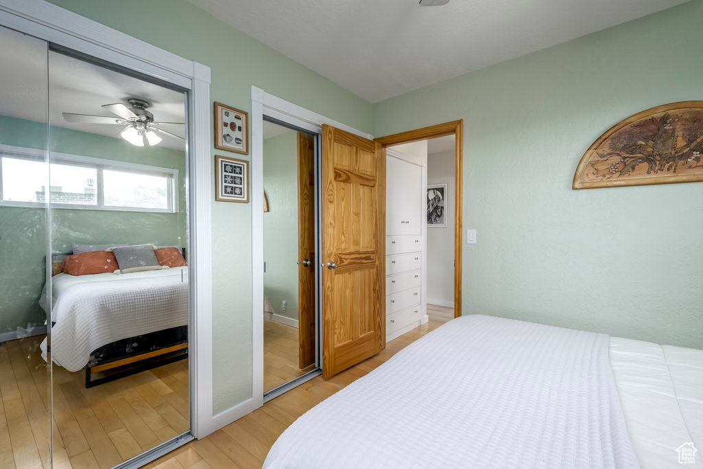 Bedroom with wood-type flooring and ceiling fan