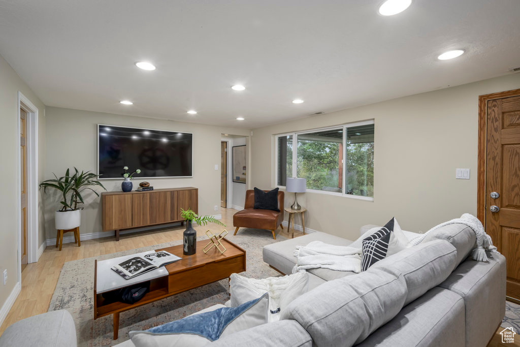 Living room with light hardwood / wood-style flooring