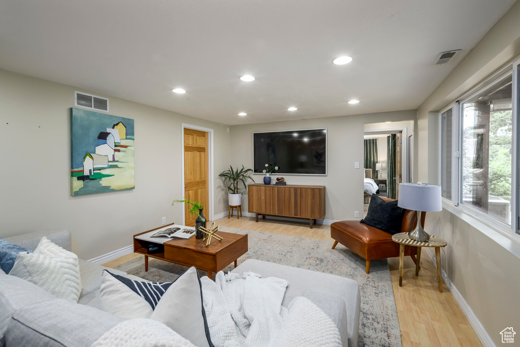 Living room with light wood-type flooring