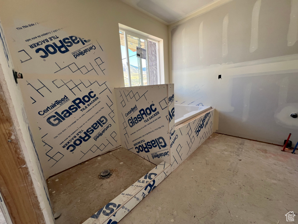 Bathroom featuring concrete flooring