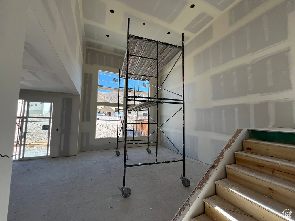 Stairs featuring concrete floors