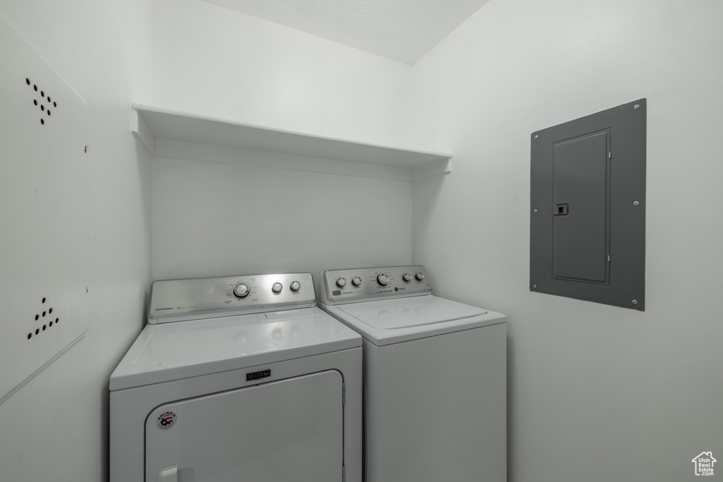 Washroom featuring washer and clothes dryer and electric panel