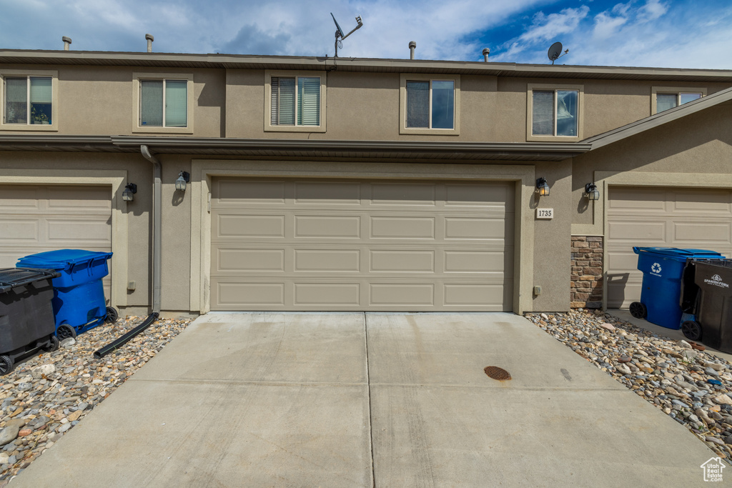 View of front of property featuring a garage