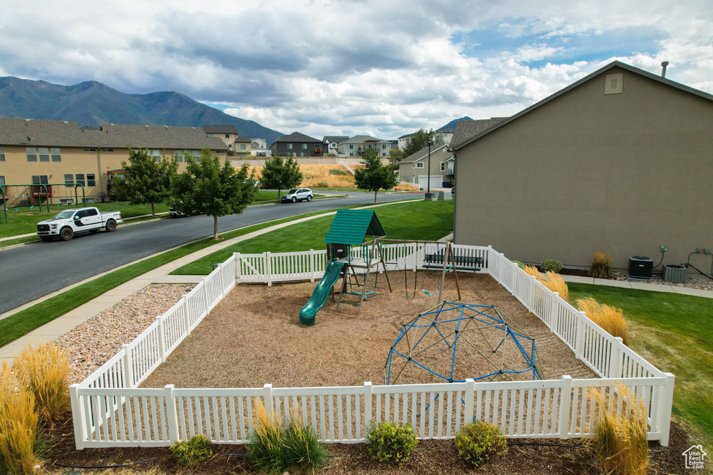 View of playground with a mountain view