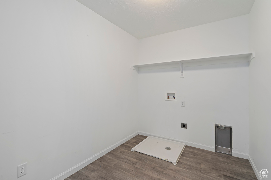 Laundry area featuring washer hookup, electric dryer hookup, and dark wood-type flooring