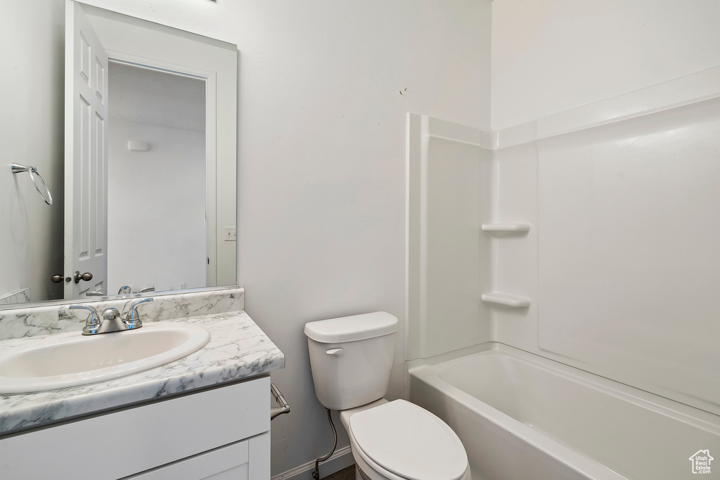 Full bathroom with  shower combination, vanity, and toilet