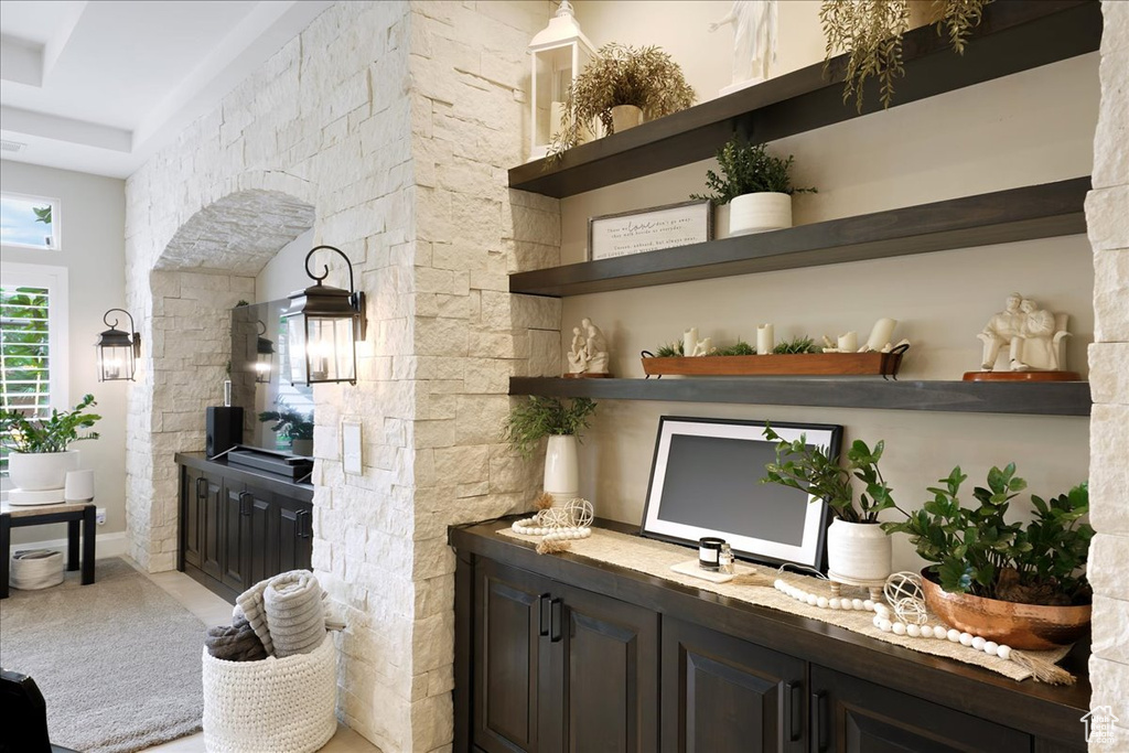 Bar featuring dark brown cabinets and carpet flooring