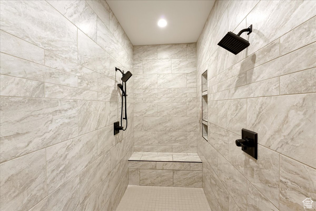 Bathroom featuring tiled shower