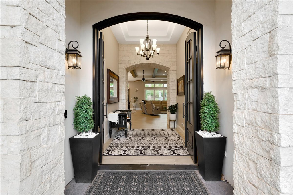 Entrance to property with ceiling fan