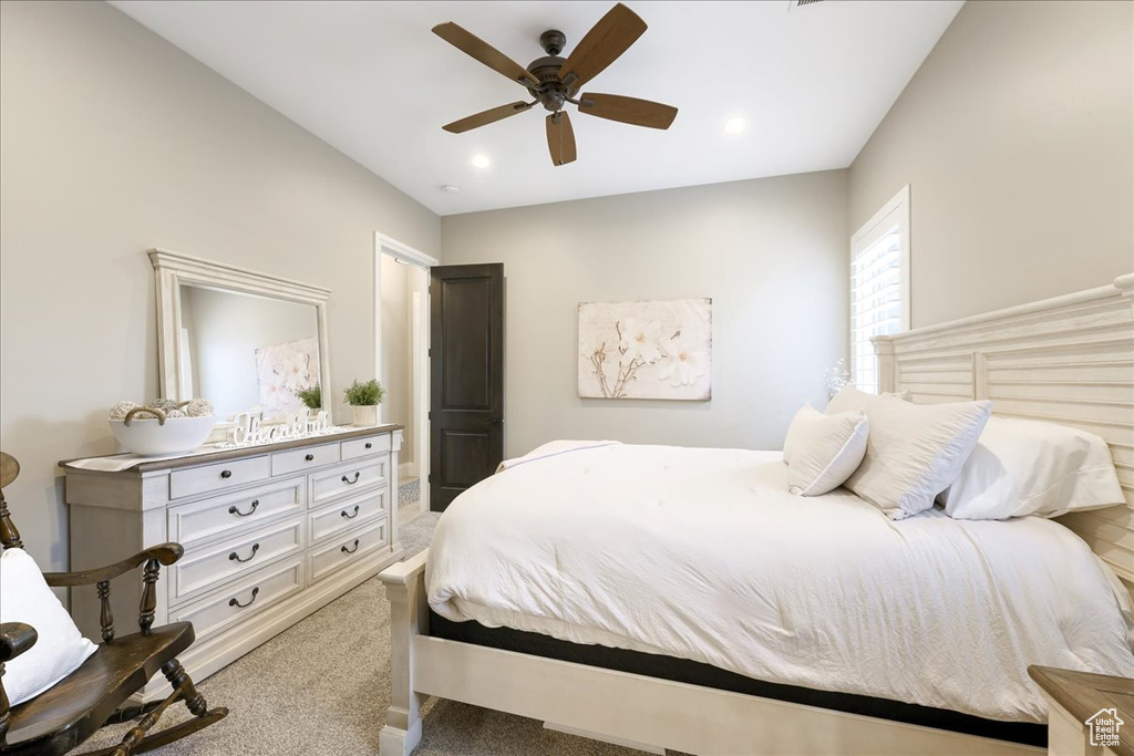 Bedroom featuring ceiling fan and carpet floors