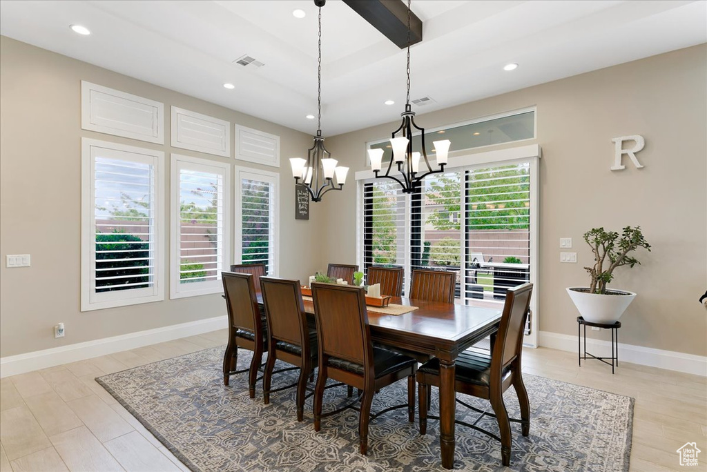 Dining space featuring a chandelier and light hardwood / wood-style flooring