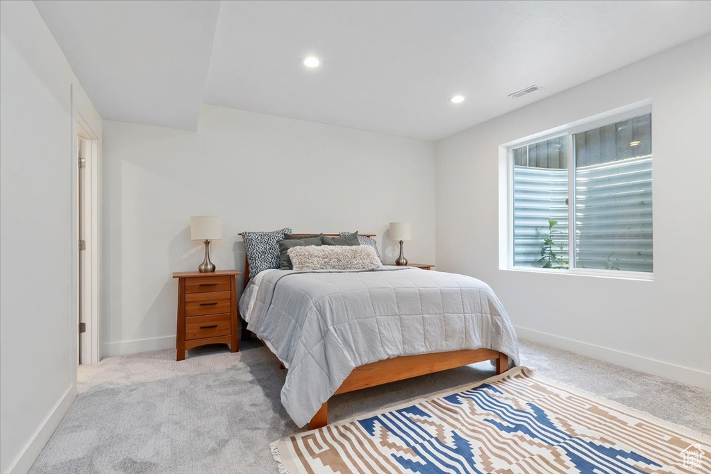 Bedroom with light carpet