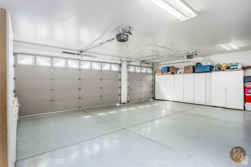 Garage featuring a garage door opener