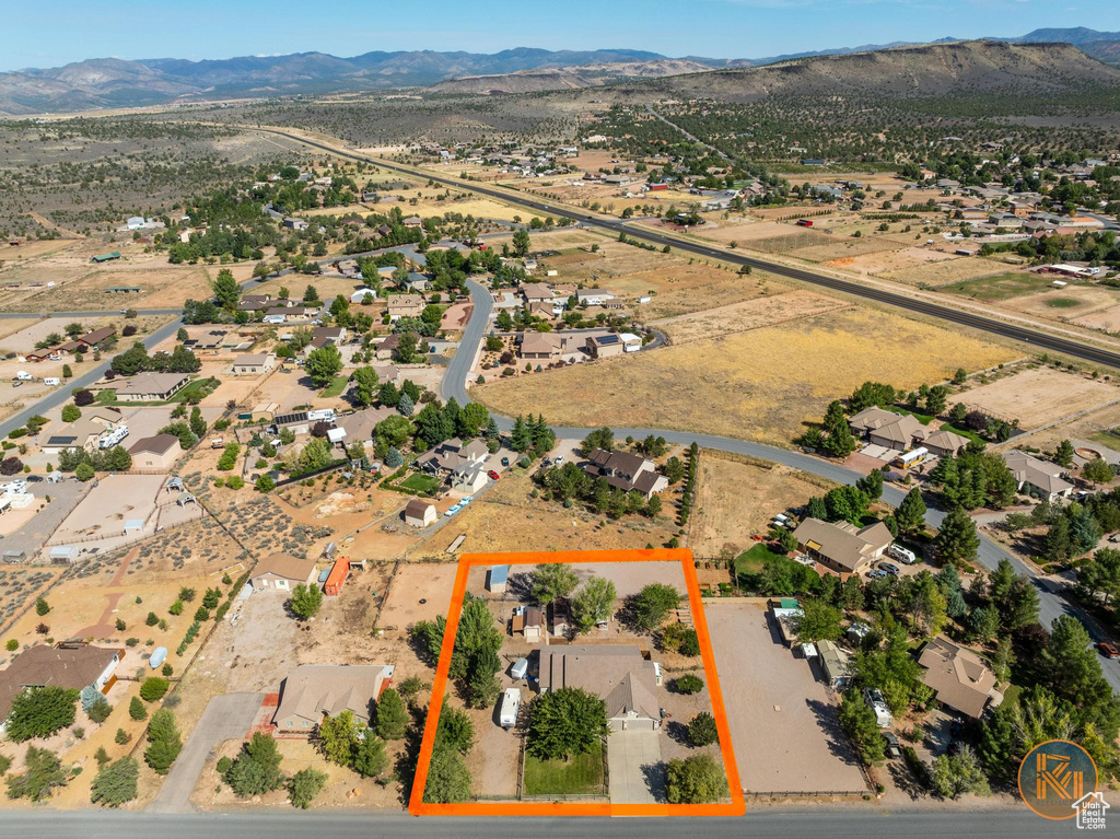 Birds eye view of property with a mountain view