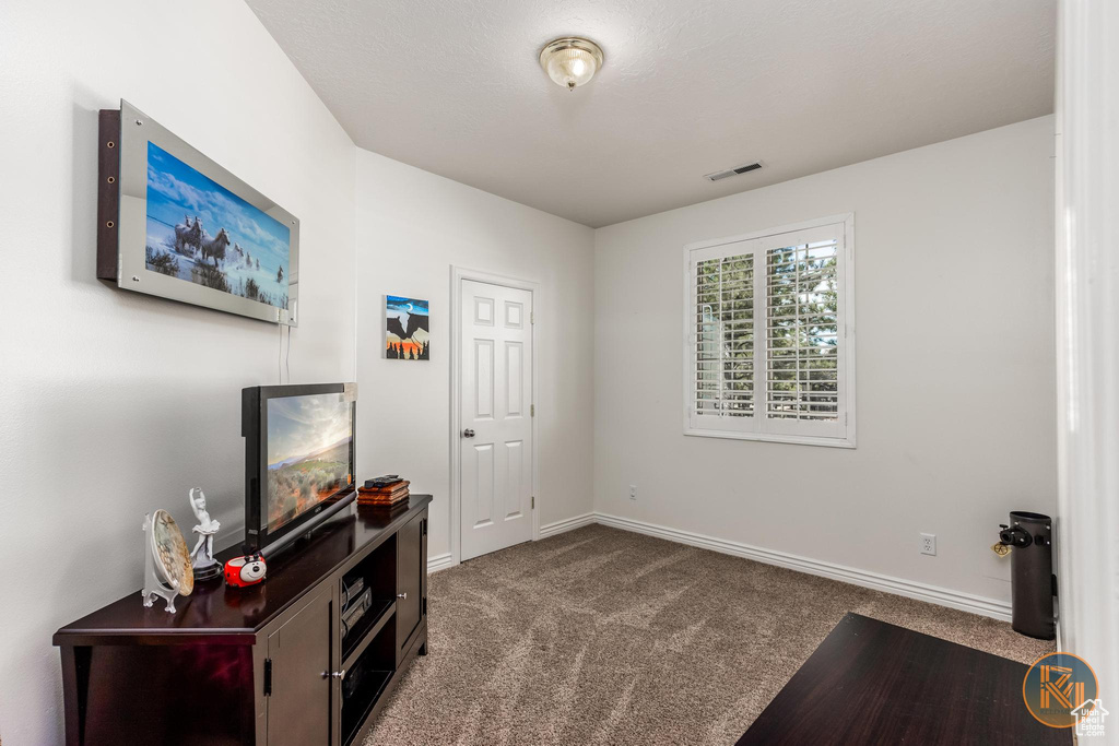 Living area featuring carpet