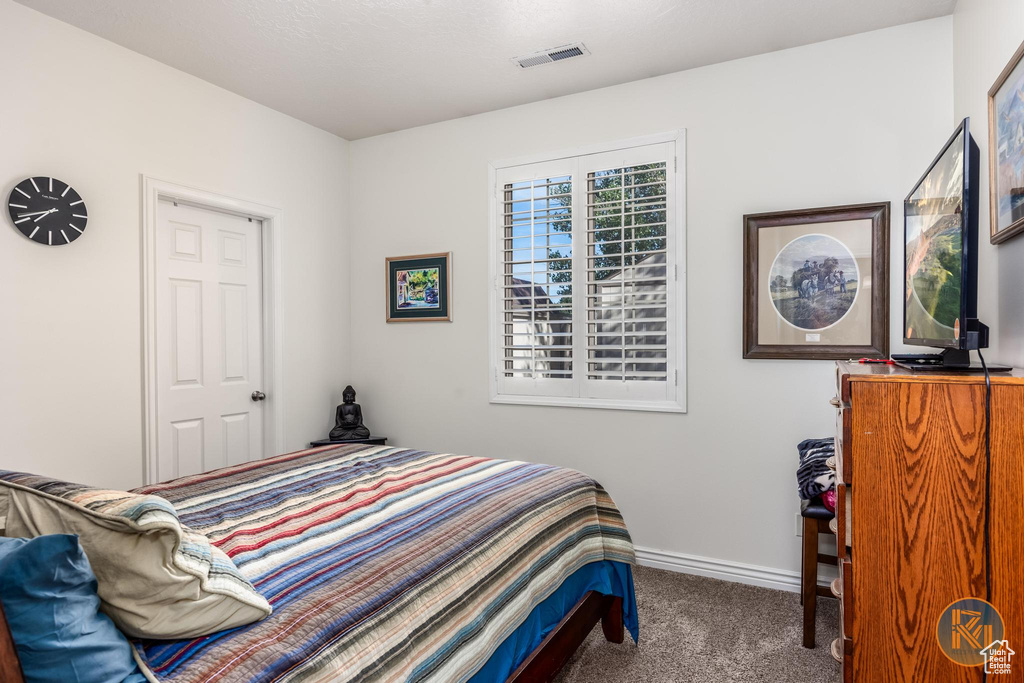 Bedroom with carpet flooring