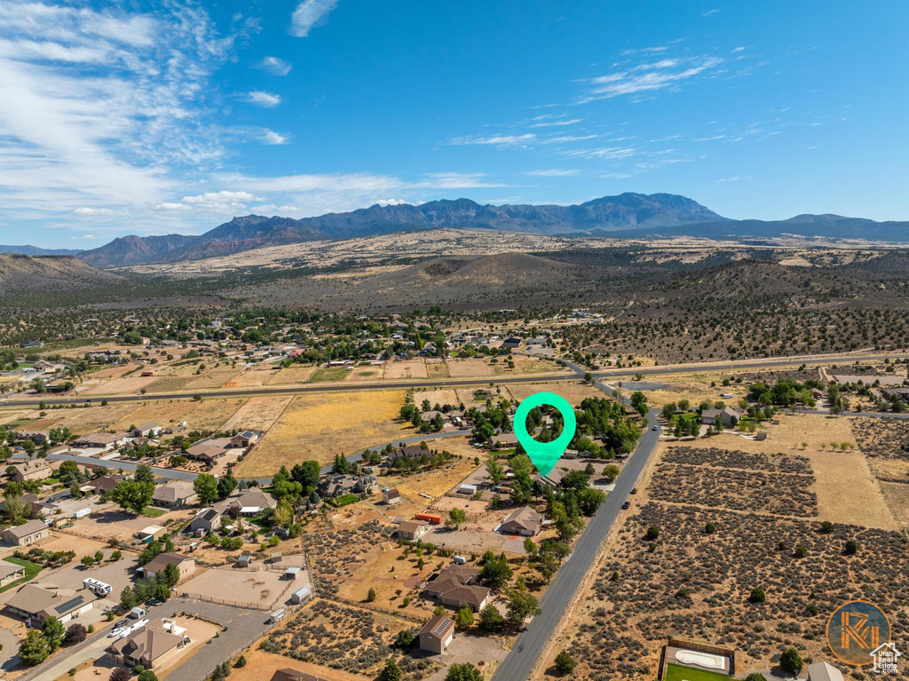 Birds eye view of property with a mountain view