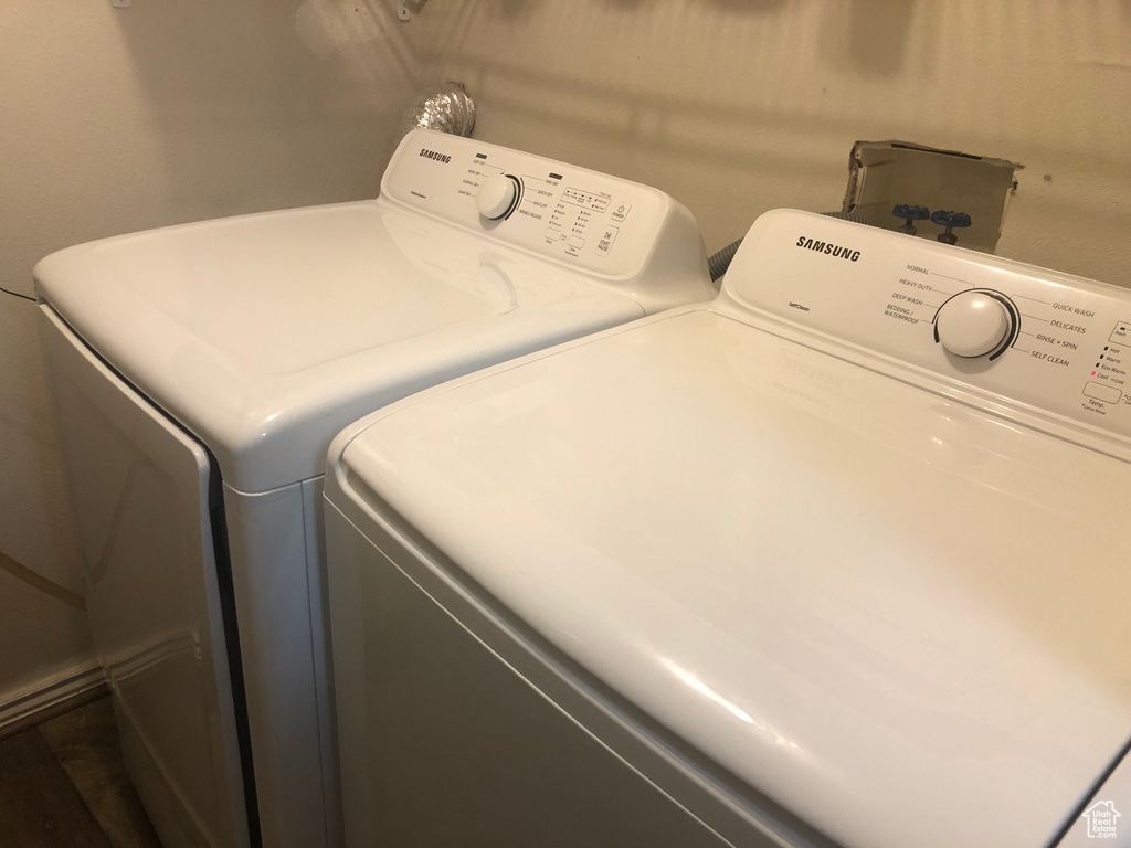 Clothes washing area featuring washer and clothes dryer