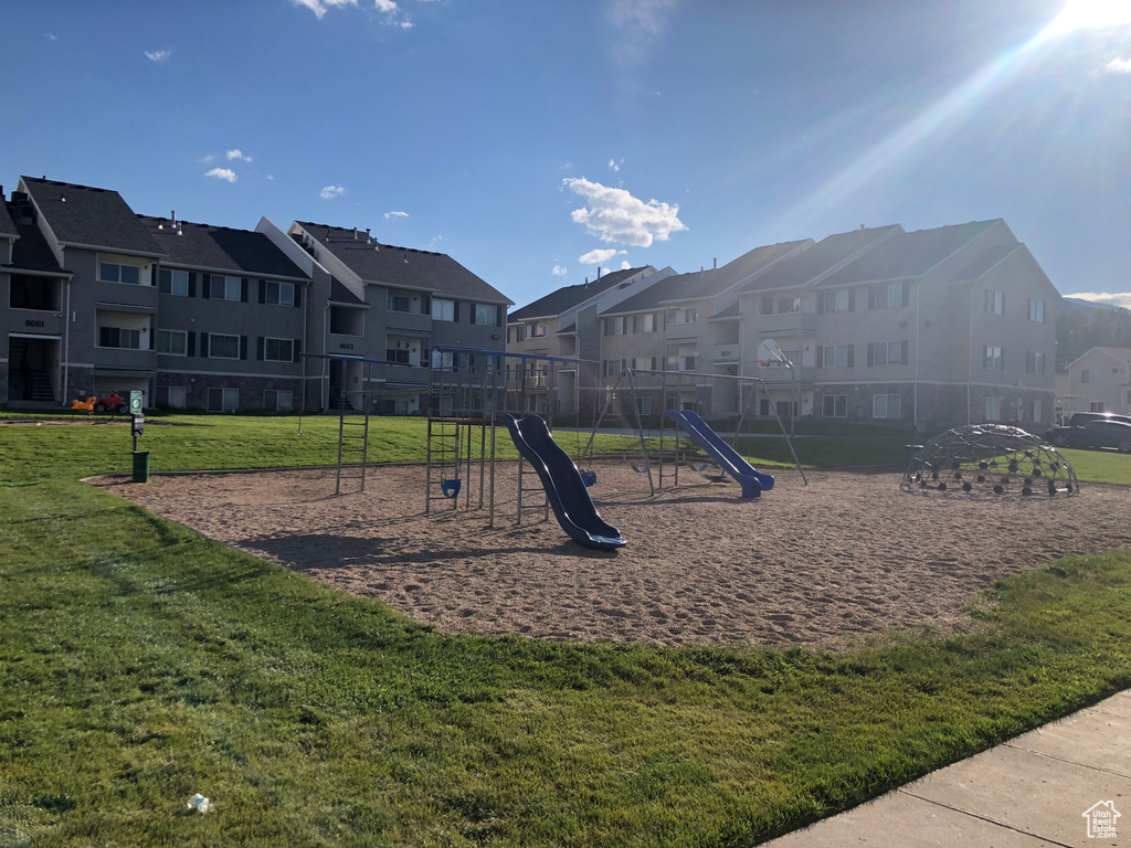 View of play area with a lawn