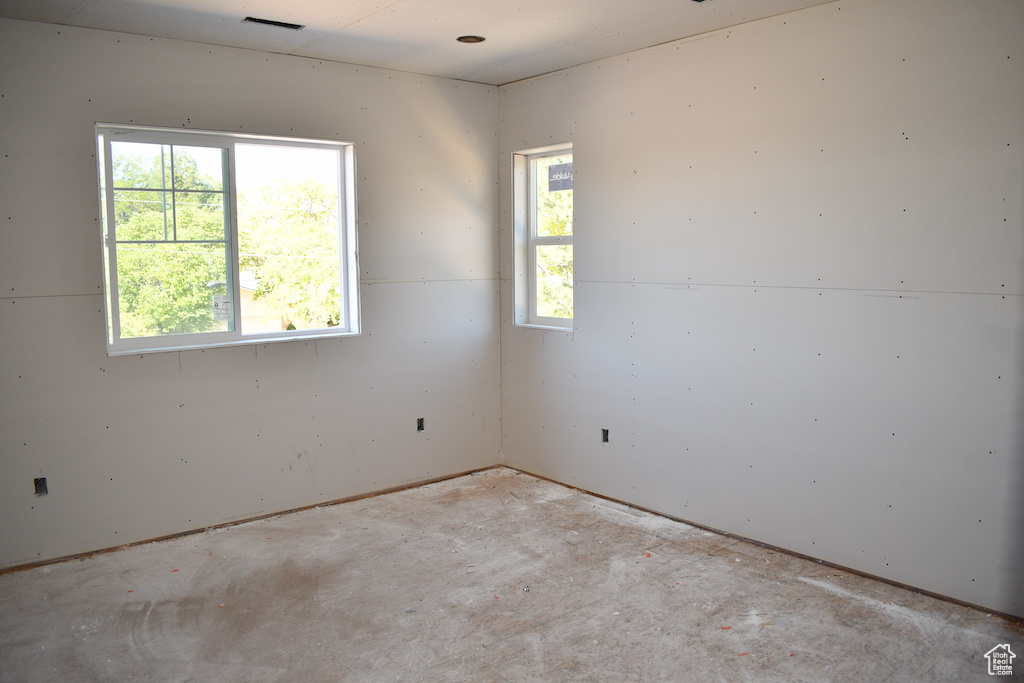 Spare room featuring plenty of natural light