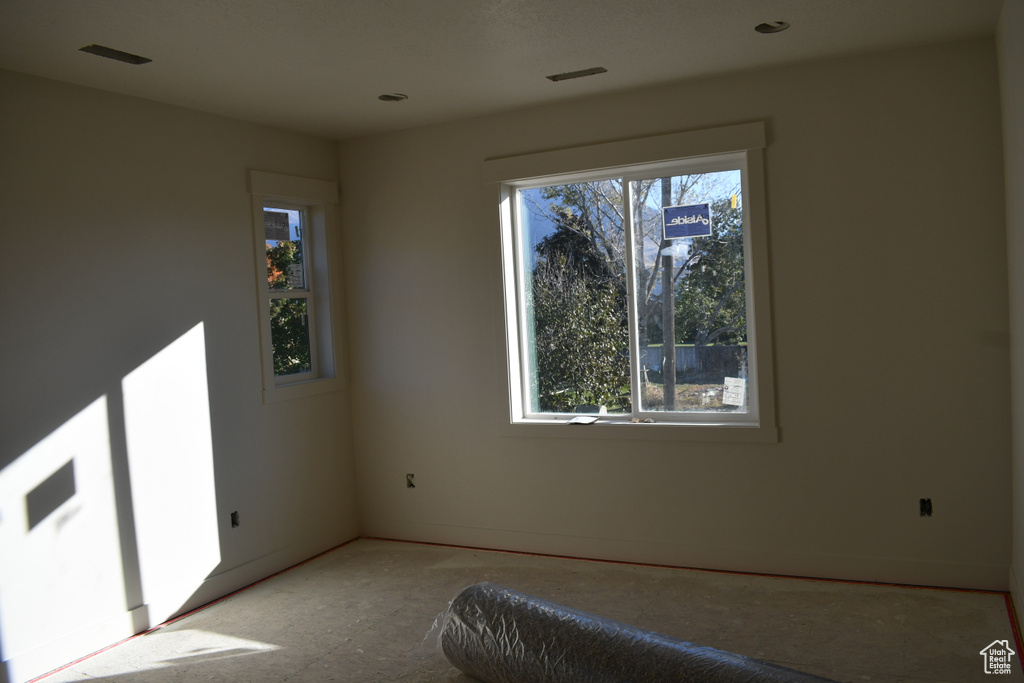 Unfurnished bedroom featuring multiple windows