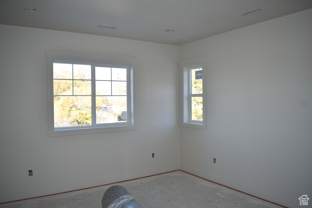 Unfurnished room with concrete floors