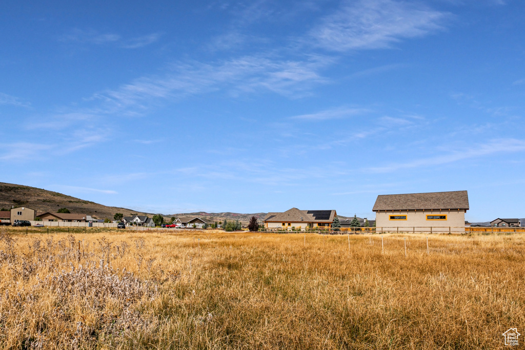 View of yard featuring a mountain view and a rural view