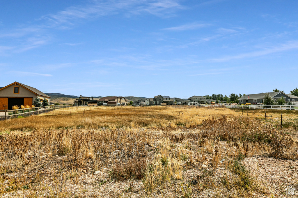 View of yard with a rural view