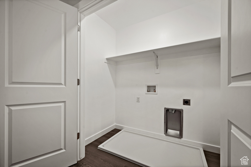 Laundry area with washer hookup, dark wood-type flooring, and hookup for an electric dryer