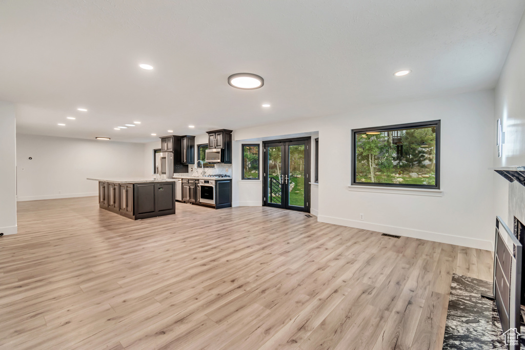 Unfurnished living room with light hardwood / wood-style floors