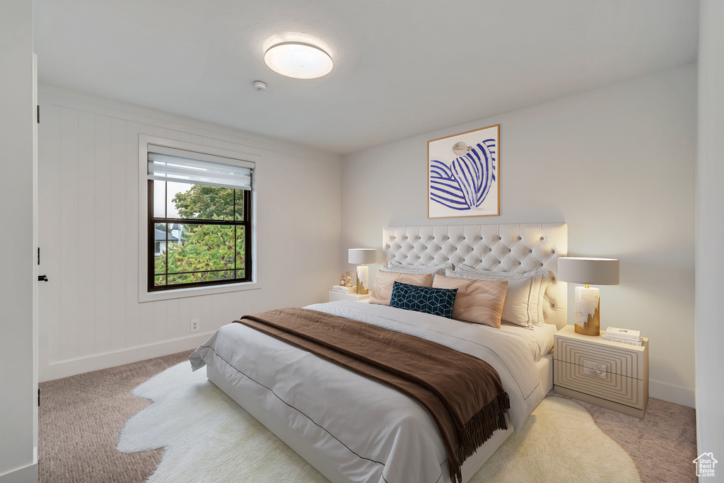 Bedroom with light carpet