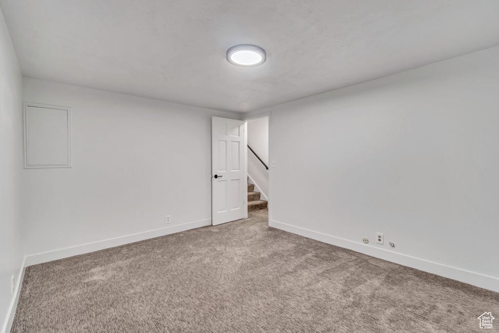 Unfurnished room featuring carpet flooring