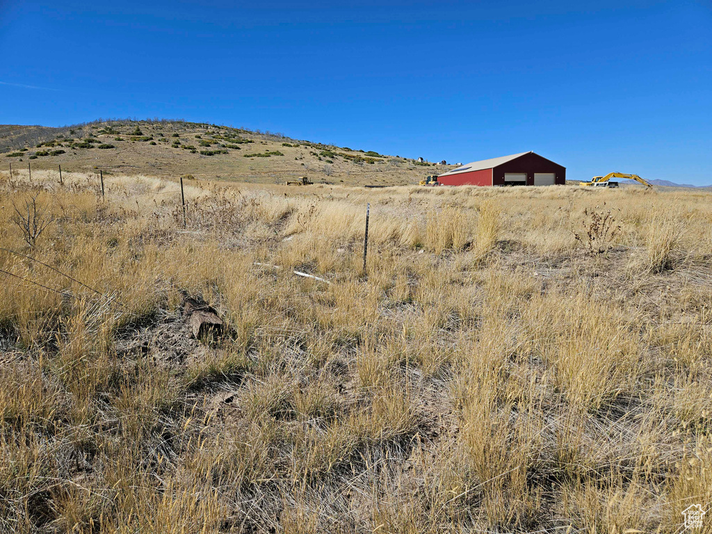 Property view of mountains with a rural view