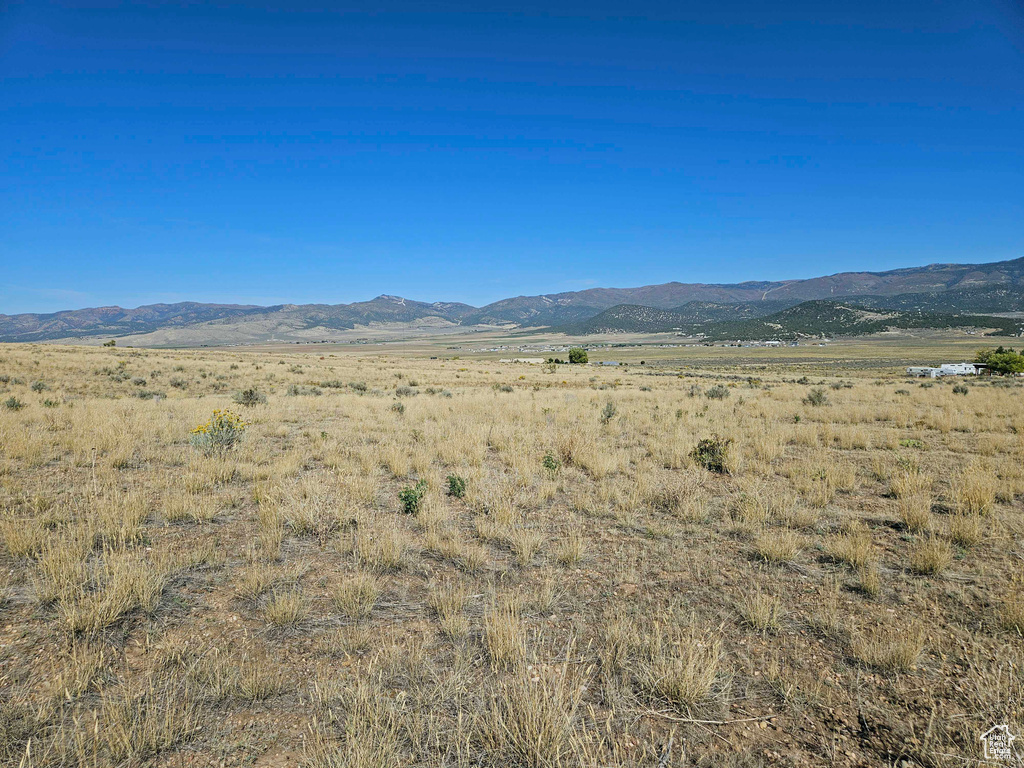 Property view of mountains with a rural view