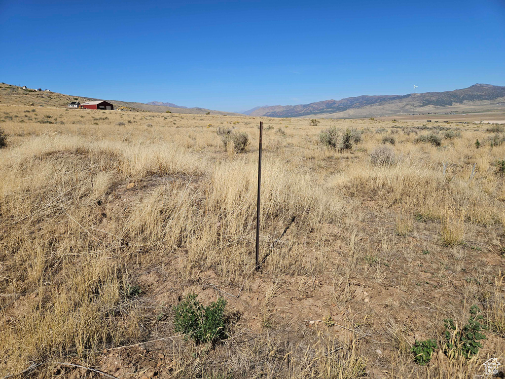 Property view of mountains with a rural view