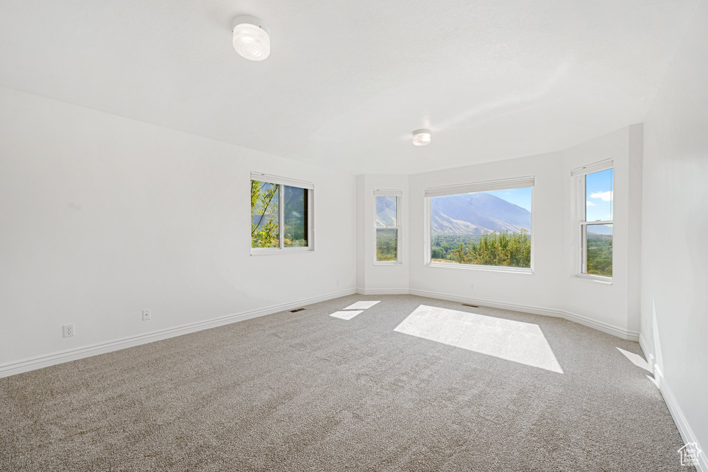 Empty room with carpet floors