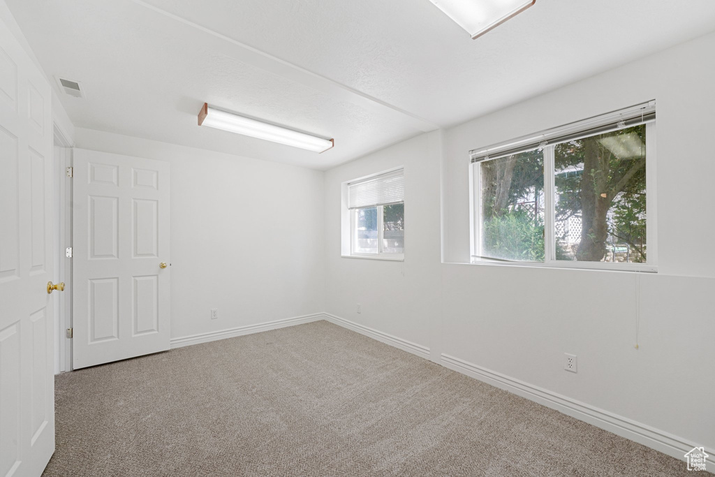 Unfurnished room featuring carpet floors