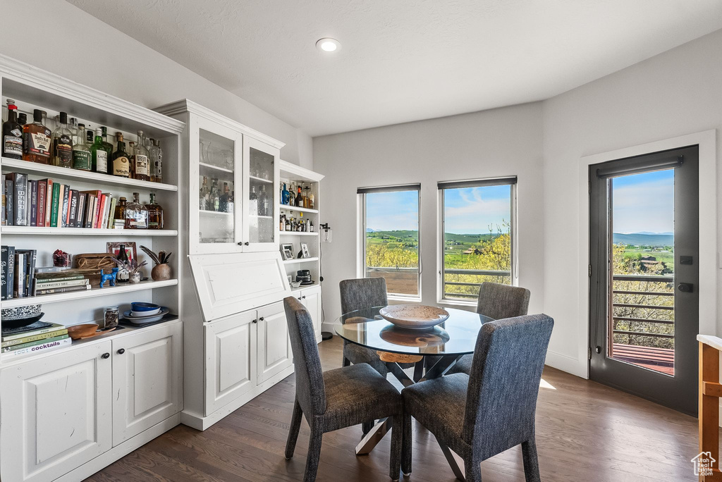 Dining area featuring dark hardwood / wood-style flooring