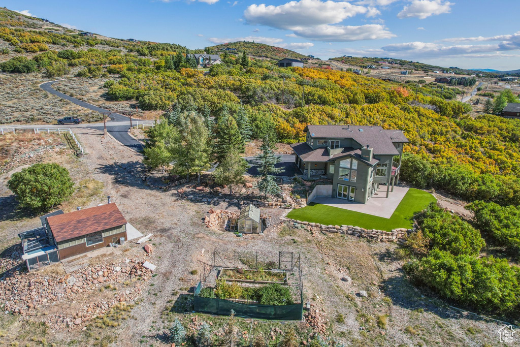 Birds eye view of property with a mountain view