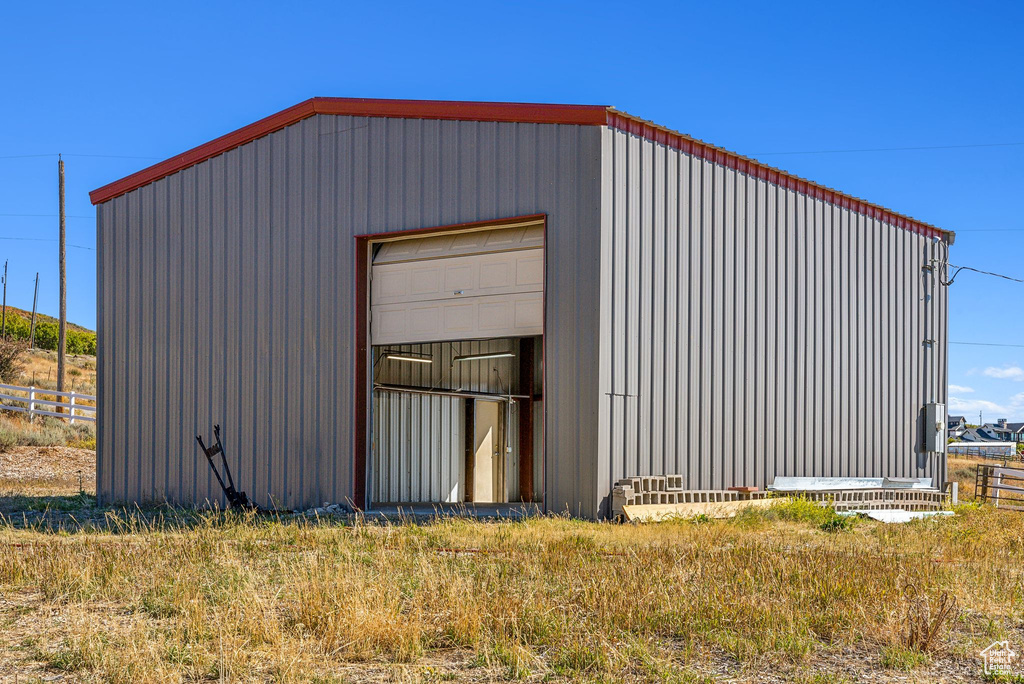 View of outdoor structure featuring a garage