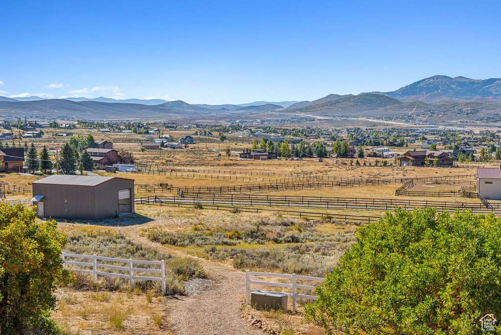 Property view of mountains with a rural view