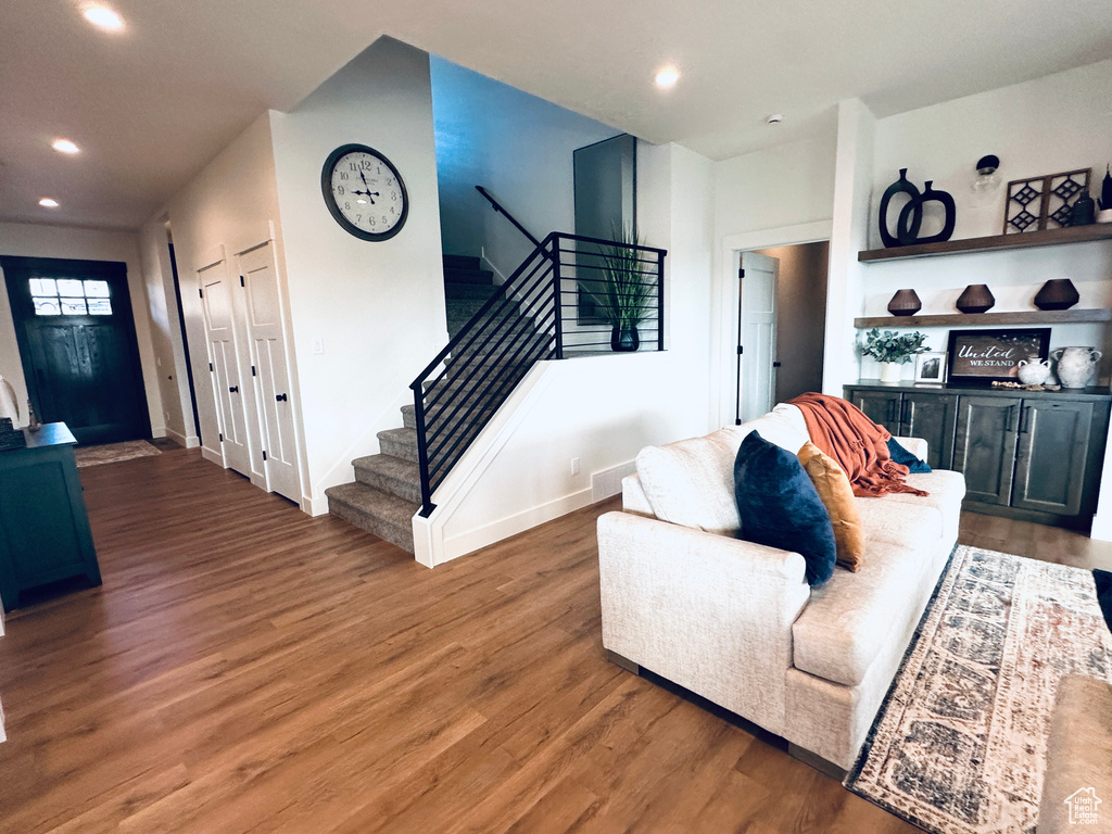 Living room with dark hardwood / wood-style floors