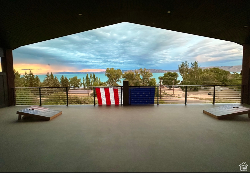 Patio terrace at dusk with a mountain view