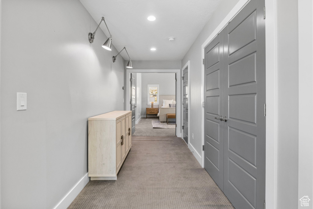 Hall with light colored carpet