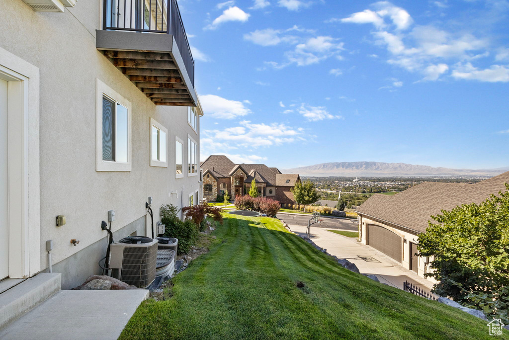 View of yard featuring cooling unit and a mountain view