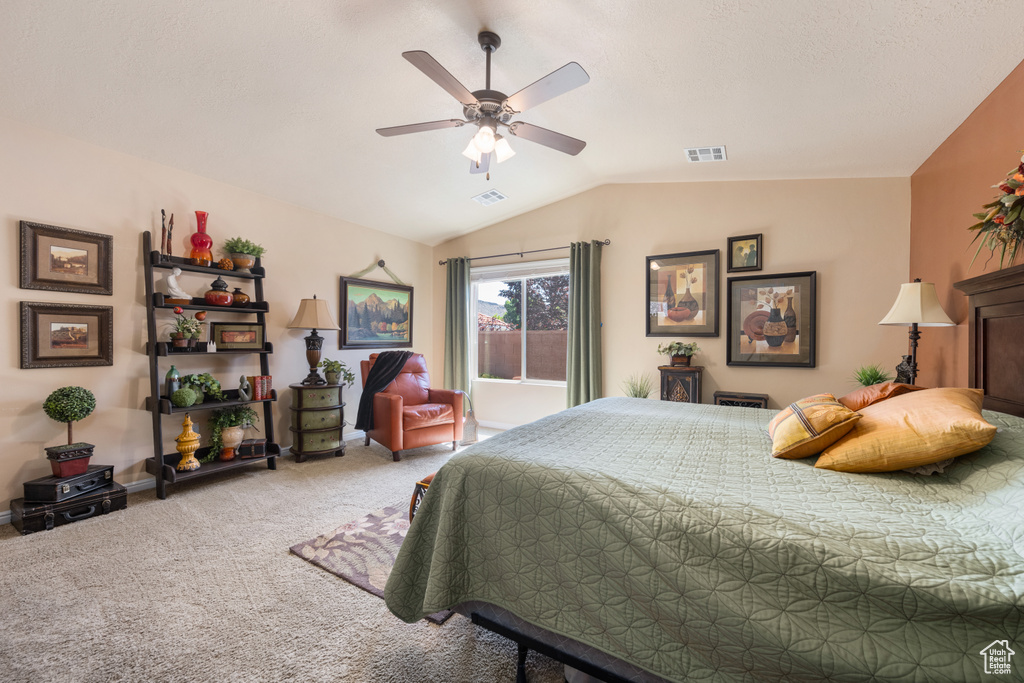 Bedroom with carpet, lofted ceiling, and ceiling fan