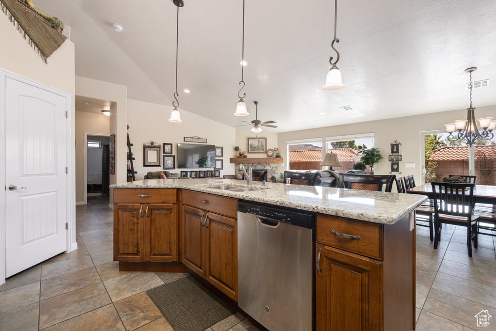 Kitchen with lofted ceiling, dishwasher, ceiling fan with notable chandelier, and decorative light fixtures