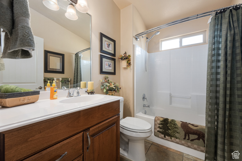 Full bathroom with shower / bath combo, vanity, toilet, and tile patterned floors