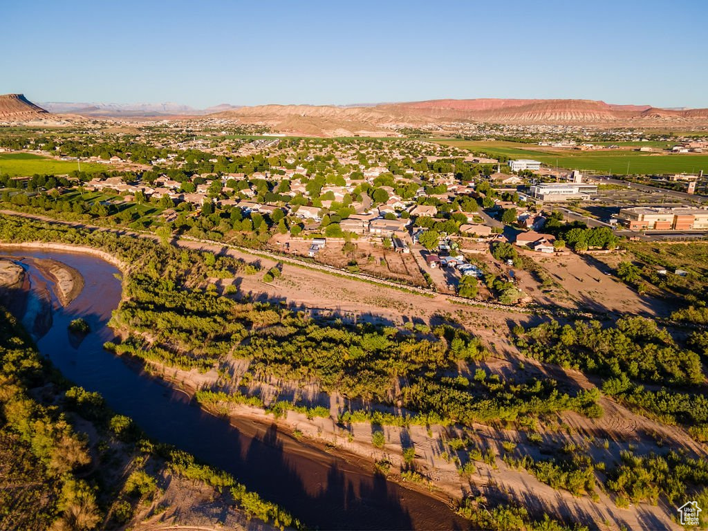 Drone / aerial view with a water and mountain view